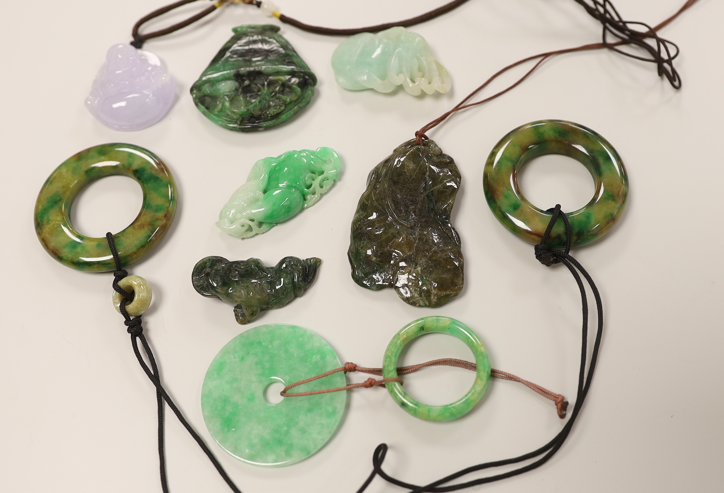Eight assorted jade and hardstone carvings and pendants, largest 7cm long